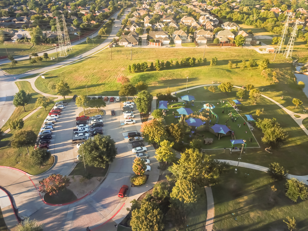 Aerial view of a neighborhood and playground during the day time