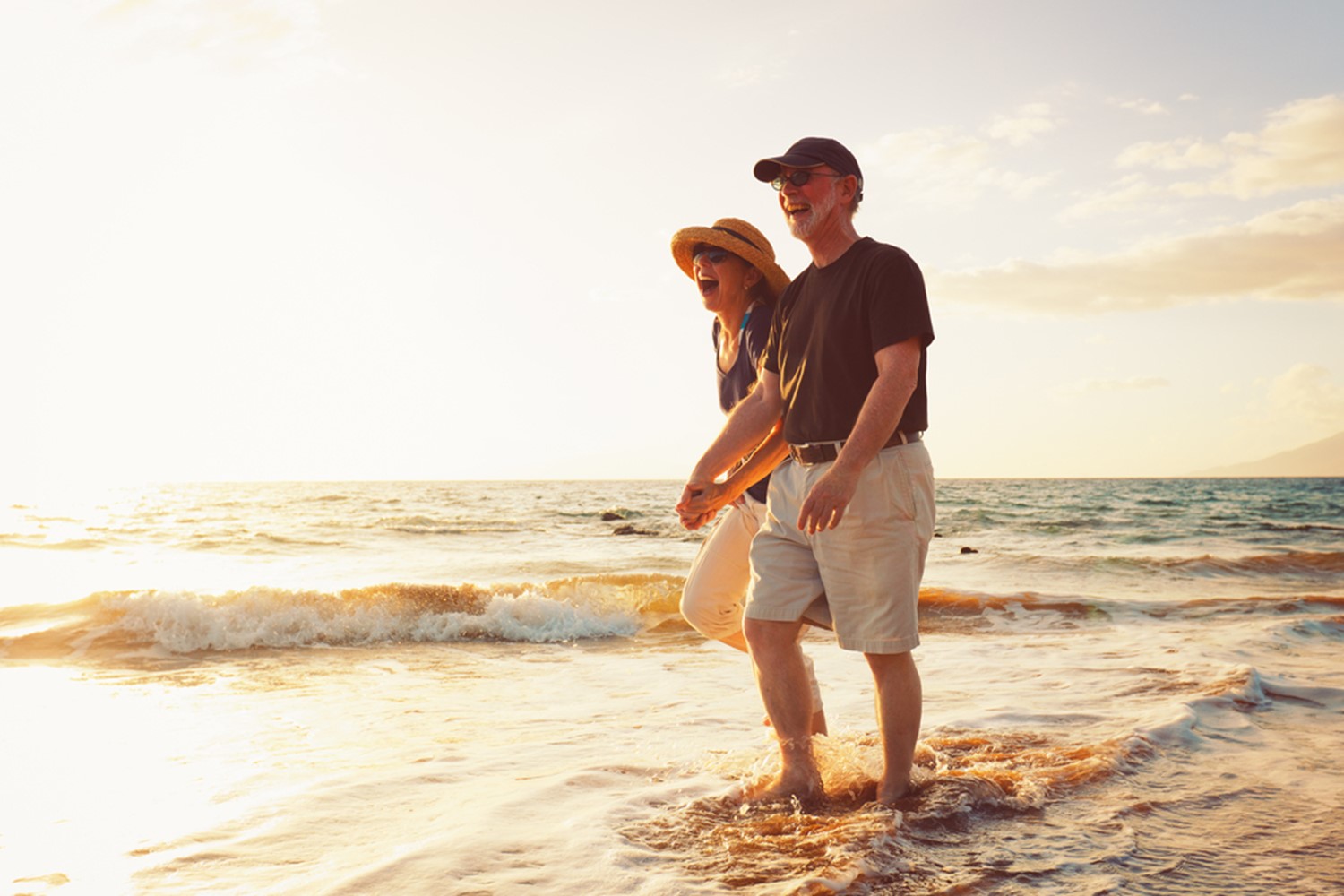 happy old couple in ocean in Destin, FL