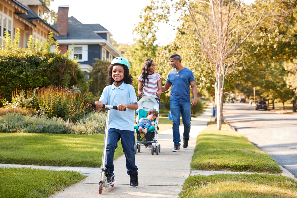 Family walking down neighborhood