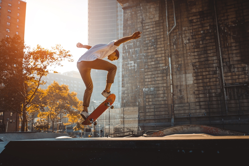 Person doing a trick on a skateboard in a park