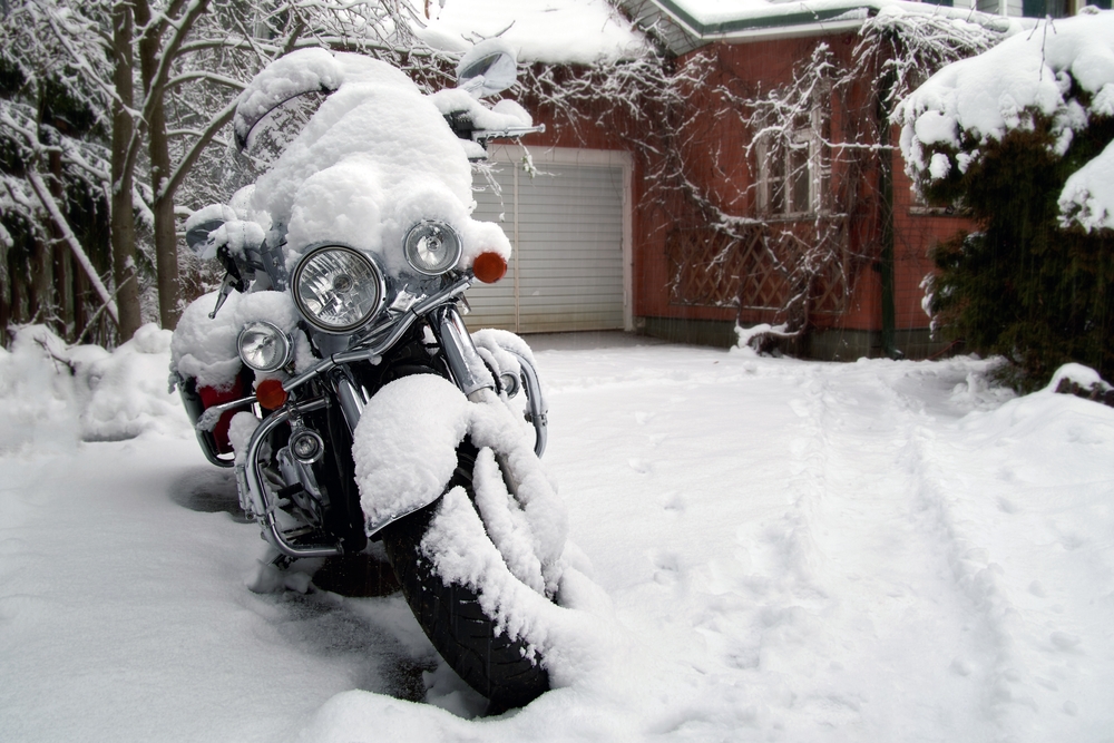 Motorcycle covered in snow