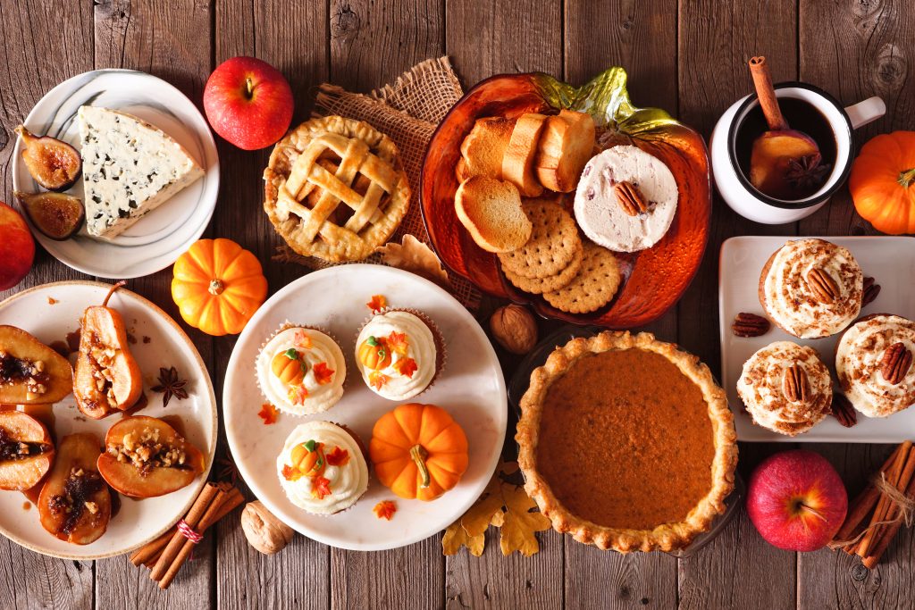 A table full of fall-themed baked goods.
