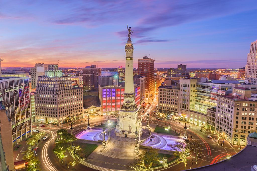The city center of Indianapolis, a large circular park surrounding a tall monument.