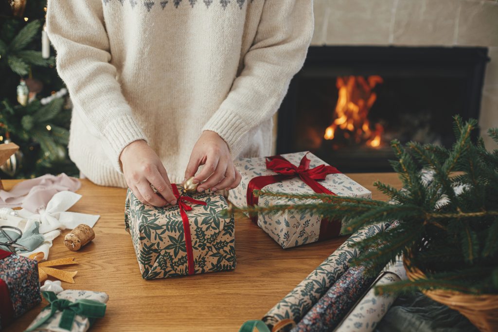 A woman wrapping Christmas presents.