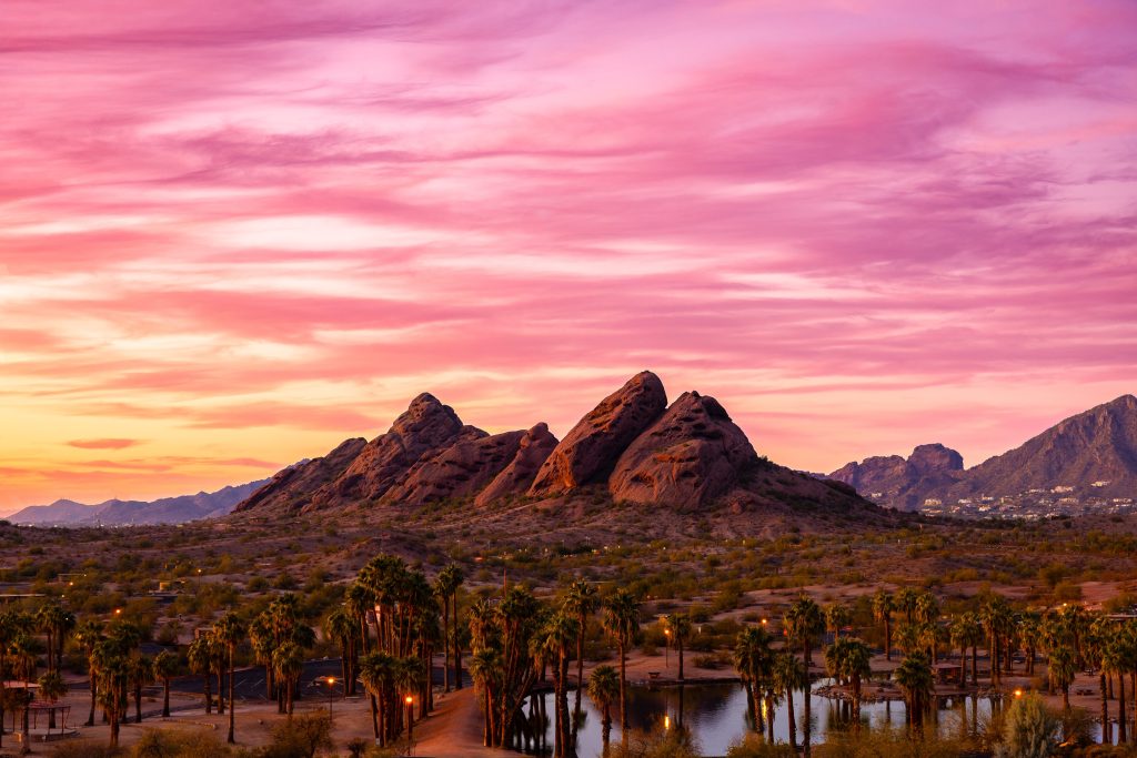A pink sunset over the mountains in Papago Park near Phoenix, Arizona.