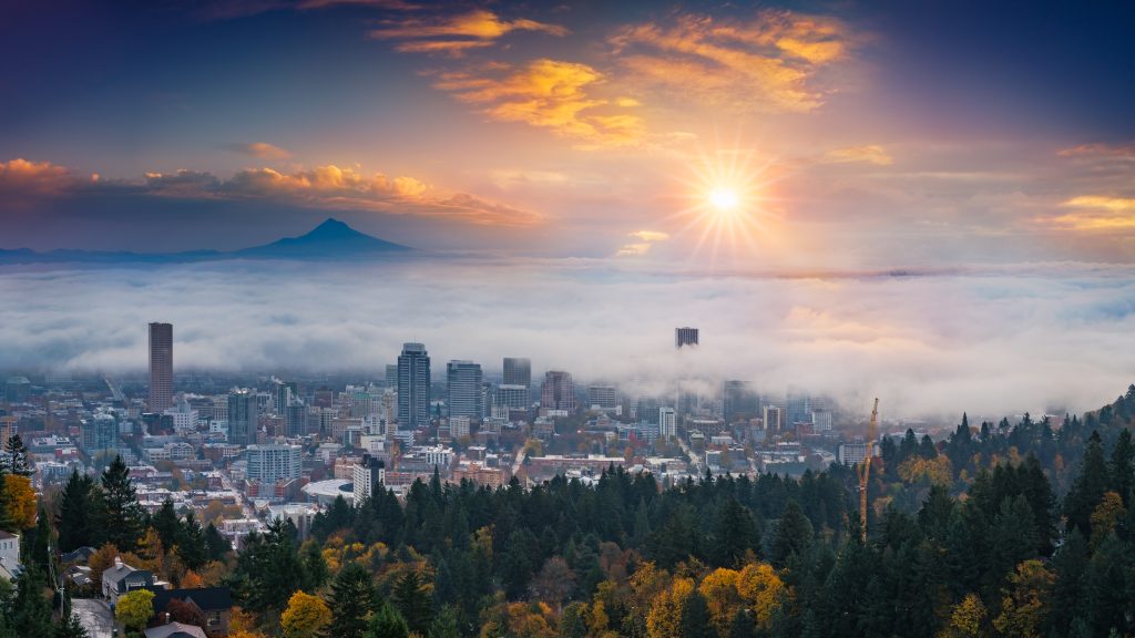 An aerial view of a misty sunset over Portland and Mt. Hood.